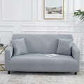 Canapé habillé de la housse extensible unie NEWTON gris clair