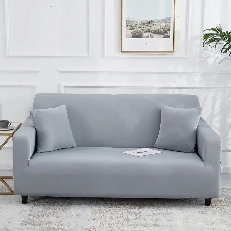 Canapé habillé de la housse extensible unie NEWTON gris clair